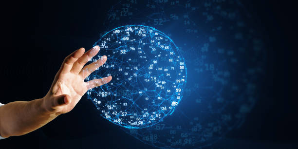 istock A hand interacting with a digital holographic globe with numerical data, on a dark blue technology-inspired background, concept of global digital connectivity 2157088349
