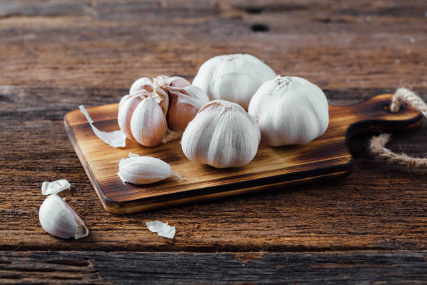 istock garlic on wooden background 2157093595