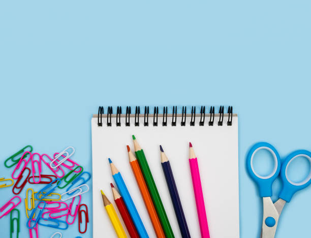 istock Colorful school stationery and blank notebook on a blue background. Flatlay. Top view. Back to school. Copy space. 2157100903