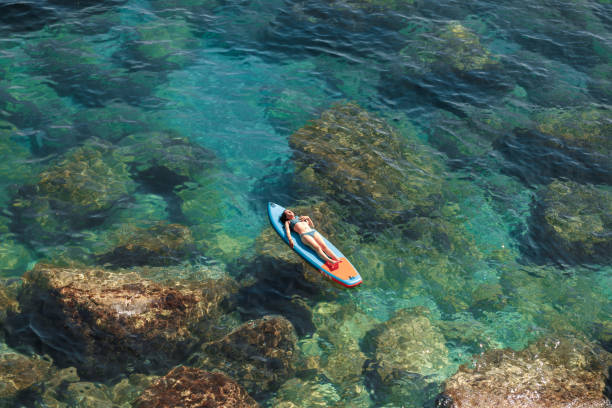 istock Enjoying the paddle board at sea 2157101875