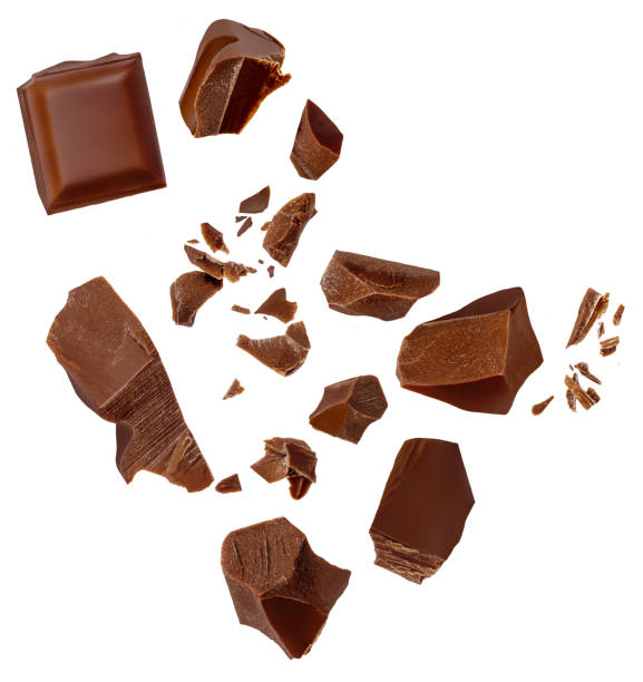istock Isolated Chocolate bar pieces falling on white background. Milk Chocolate explosion with  cocoa crumbs and shavings,  Top view. Flat lay. Pattern 2157103402