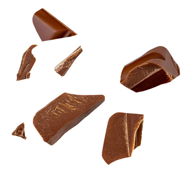 istock Broken chocolate bar pieces falling on white background. Milk  chocolate chunks  Collection. 2157103484