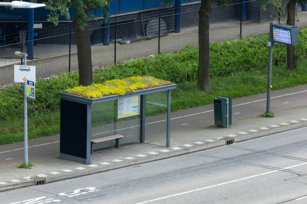Utrecht, the Netherlands. 8 June 2024. Modern bus stop with garden on the roof and Bus Stop sign with LED Display destination Utrecht Central Station.