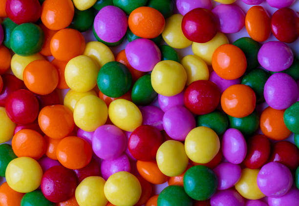 istock A Pile of Rainbow Colored Candy Coated Chocolate Buttons Isolated 2157106210