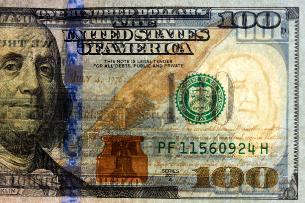 istock Close-up one hundred US dollar bill, top view point 2157109055