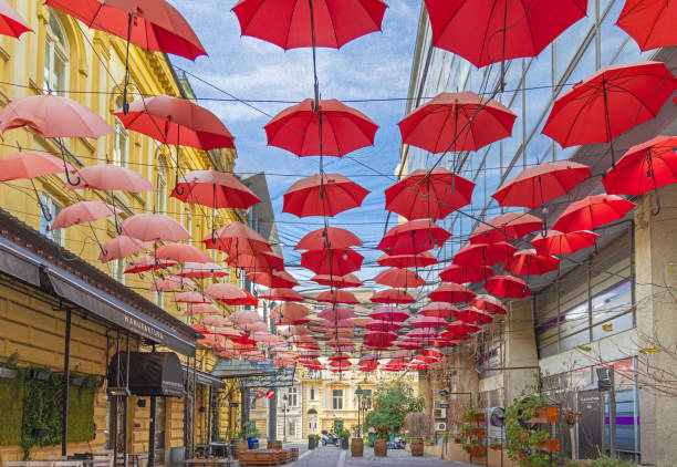 Belgrade, Serbia - November 28, 2021: Street Covered With Red Umbrellas Decoration in Front of Manufaktura Restaurant City Centre.