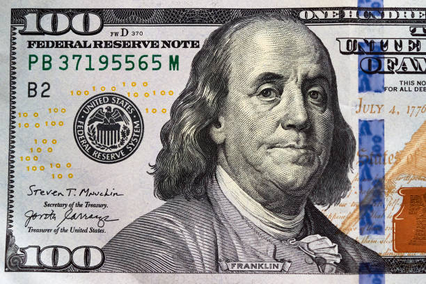 istock Close-up one hundred US dollar bill, top view point 2157110652
