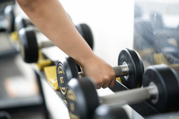 istock female pick up dumbbells 2157112028
