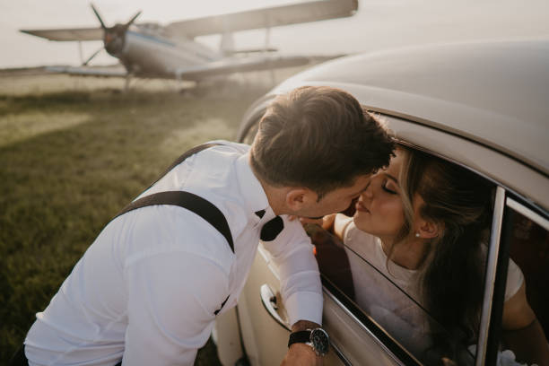 istock Pre-wedding shoot of a bride and groom  with old timer car 2157113577