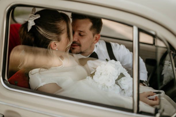 istock Pre-wedding shoot of a bride and groom  with old timer car 2157114231
