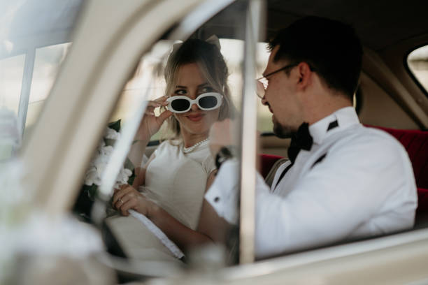 istock Pre-wedding shoot of a bride and groom  with old timer car 2157114254