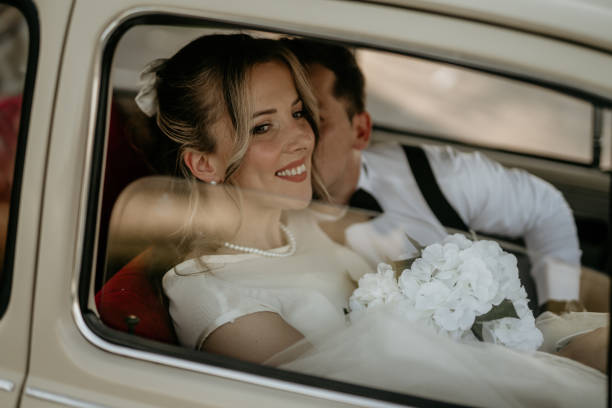 istock Pre-wedding shoot of a bride and groom  with old timer car 2157114256
