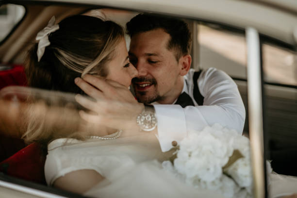 istock Pre-wedding shoot of a bride and groom  with old timer car 2157114277