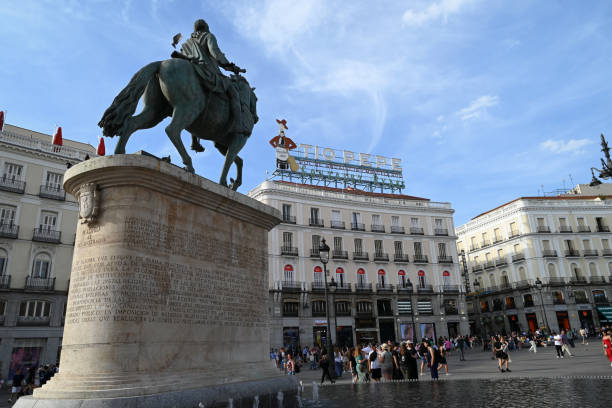 Madrid, Spain, june 5, 2024 : Equestrian statue of Carlos III made by Miguel Angel Rodríguez and located in Puerta del Sol in Madrid with tourists