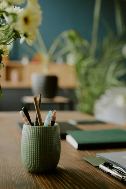 istock Green Pencil Cup on Wooden Desk 2157116523