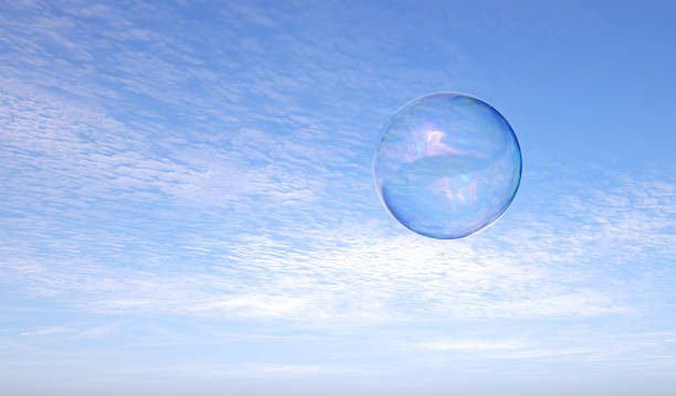 istock abstract soap bubble in front of blue sky - 3d illustration 2157117060