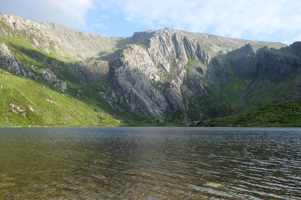 istock Cwm and Llyn Idwal, also known as The Devils Kitchen is a glacial cirque or corrie valley in the Glyderau range of mountains in northern Snowdonia, North Wales. 2157119039