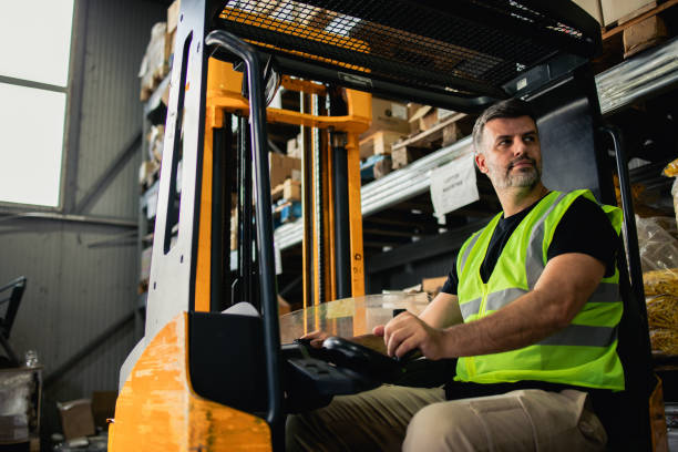 istock Worker at the warehouse working on the forklift 2157119669