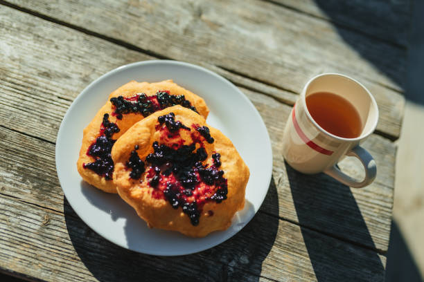 istock Traditional Bulgarian (Balkan) breakfast - Mekitzi (mekici) with jam. Hostel breakfast. 2157123130