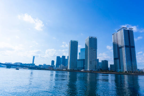 istock Tower apartments lined up along the river and a refreshing blue sky 2157123340