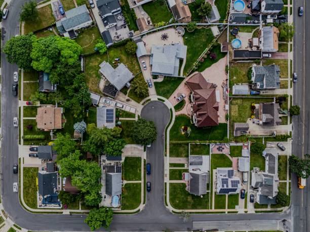 istock Top-down view over a middle-class residential neighborhood on a cloudy day. 2157123796
