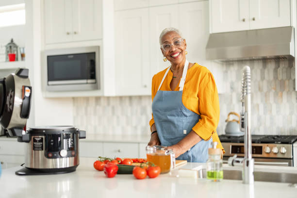 Senior Multiethnic Woman Preparing Food in Kitchen