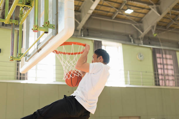 istock Boys playing basketball in the gymnasium. 2157128229