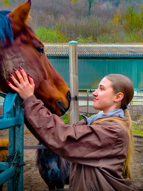 istock Young lady and a horse 2157129250