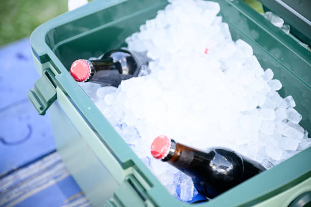 istock Cooler box with ice and glass bottles of beer or cold drinks 2157129531