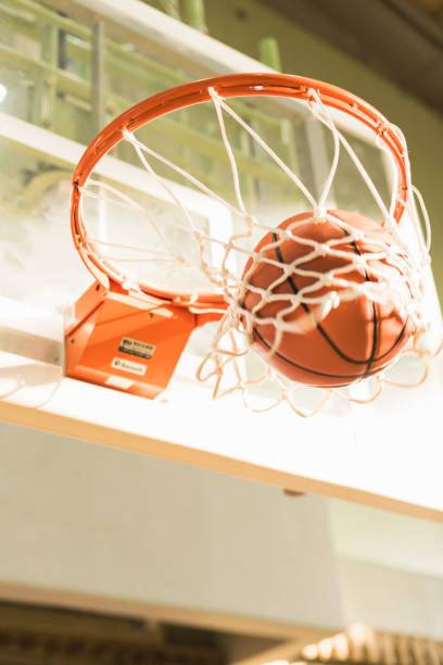 istock Balls going into basketball goal 2157129886