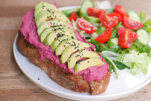 s sandwich with avocado and hummus on plate,