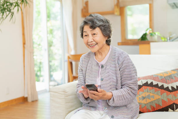 istock Senior women watching television at home. 2157131994