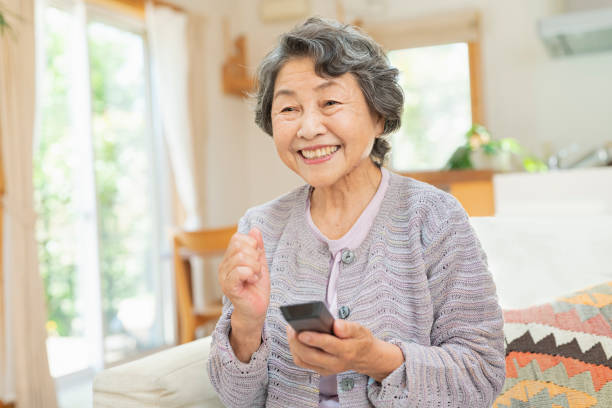 istock Senior women watching television at home. 2157132027