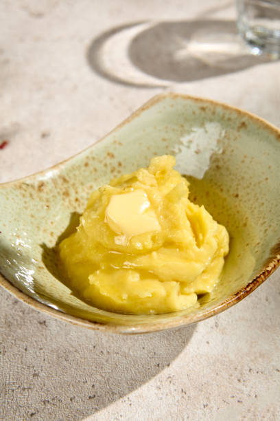 istock Creamy Mashed Potatoes with Butter in Sunlit Summer Setting 2157135419
