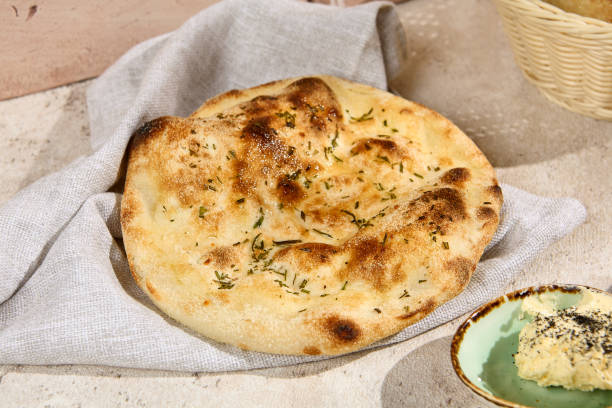 istock Rustic Rosemary Focaccia Bread with Summer Sunlight and Shadows 2157135613
