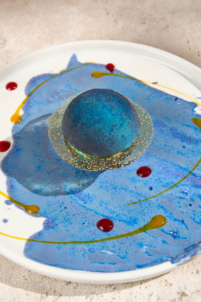 istock Cosmic Mousse Dessert Shaped Like a Planet with Sunlight and Shadows - Summer Vibes 2157135614
