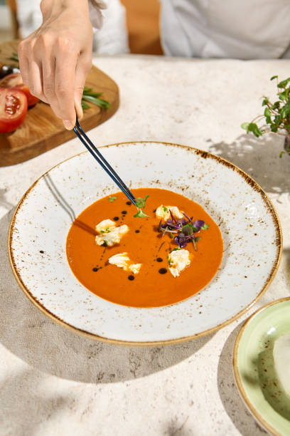 istock Tomato Soup with Burrata Cheese Garnished in Summer Sunlight and Shadows 2157135626