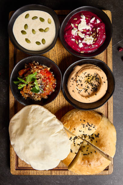 istock Mediterranean Mezze Feast: Assorted Dips with Hummus, Beetroot Spread, Tonnato Sauce, and Pita Bread 2157135738