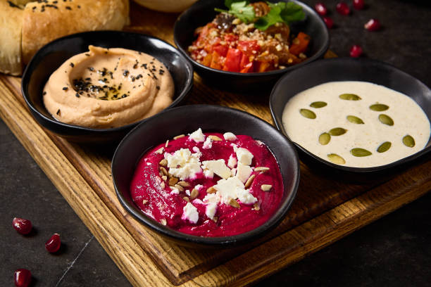 istock Assorted Meze with Pita and Flatbread Featuring Hummus, Ajapsandali, Beet Hummus, and Tonnato Sauce 2157135741