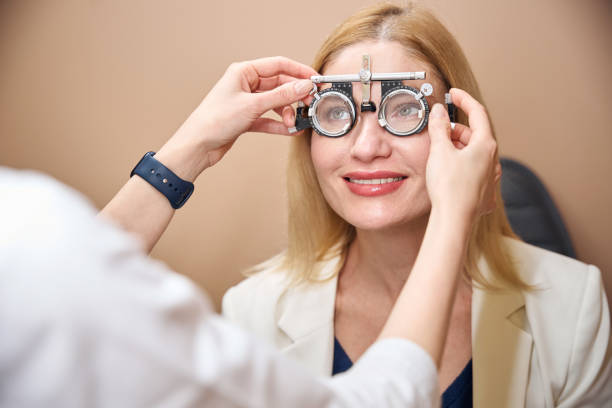 istock Ophthalmologist selects lenses for a patient 2157137970