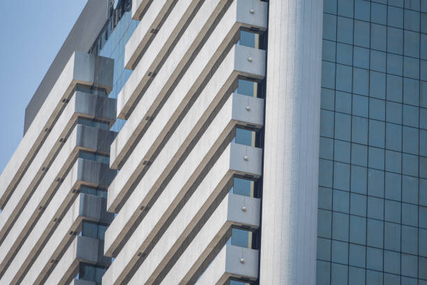 Modern office building with blue glass windows background