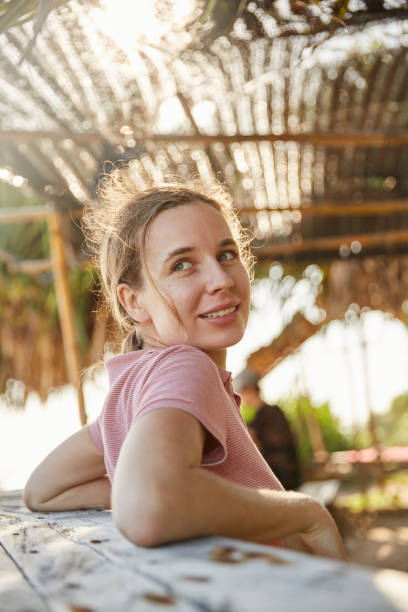 istock Young woman on the ocean shore 2157140200