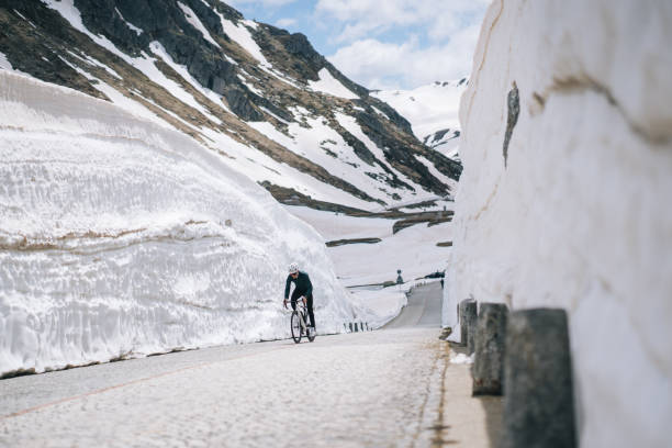 istock Road biker rides up high mountain pass 2157142089