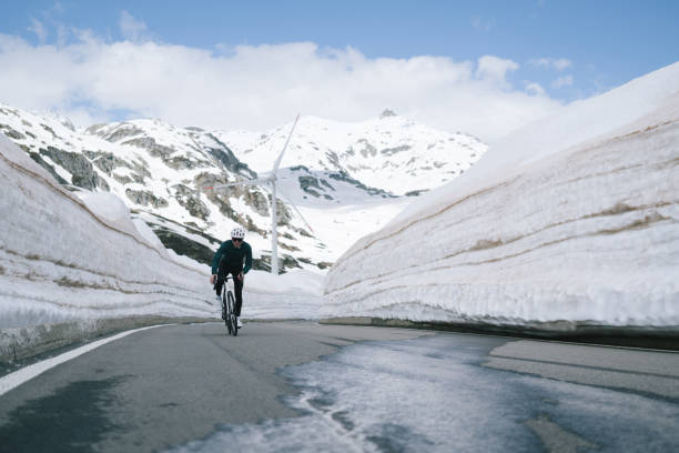 istock Road biker rides up high mountain pass 2157142233