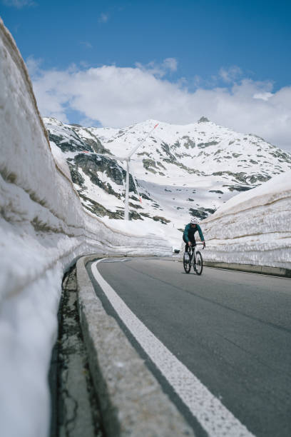 istock Road biker rides up high mountain pass 2157142299
