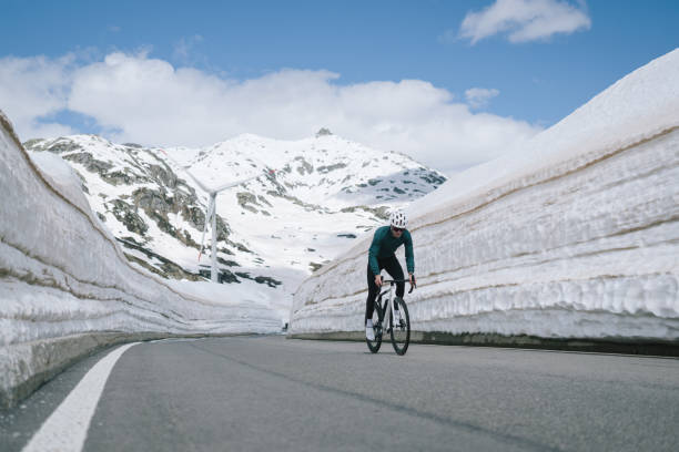 istock Road biker rides up high mountain pass 2157142303