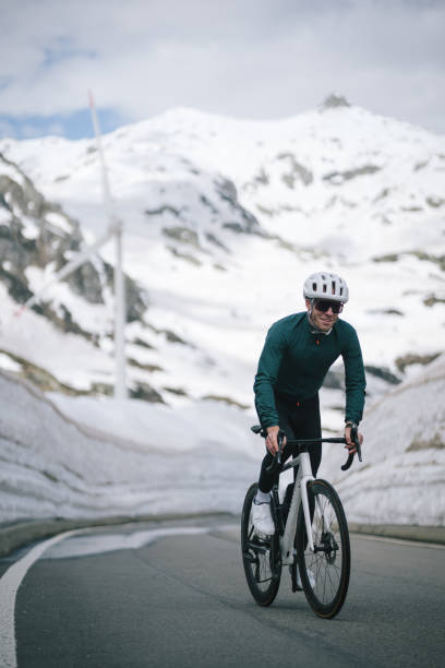 istock Road biker rides up high mountain pass 2157142370