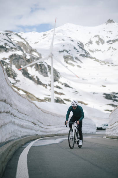 istock Road biker rides up high mountain pass 2157142376