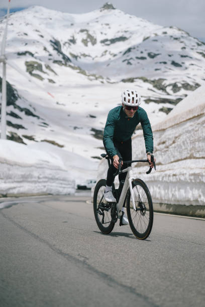 istock Road biker rides up high mountain pass 2157142522