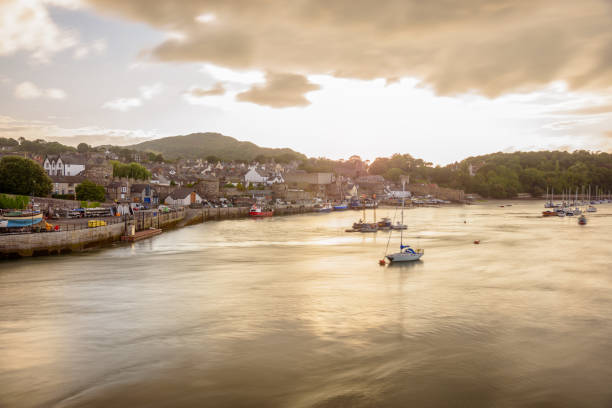 istock Conwy old town and harbour under dramatic sky at sunset 2157142622